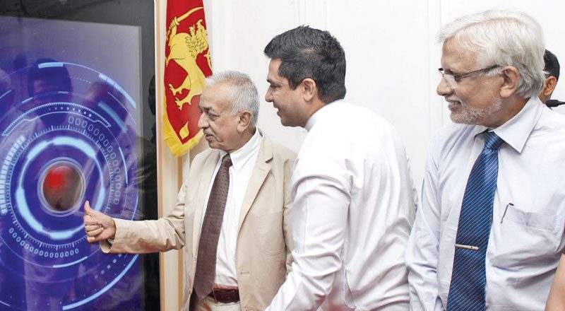 Minsters Samarawickrema and Sujeewa Senasinghe launching the Online license issuing and debiting system website. Picture by Roshan Pitipana